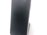 a cell phone that is sitting on top of a stand
