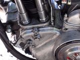 a close up view of a motorcycle engine on the ground