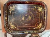 a wooden tray with a decorative design on it