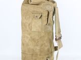 the back of a tan bag with a handle and a strap