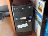 a desktop computer sitting on top of a wooden desk