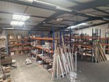 a large warehouse filled with lots of shelves and pallets