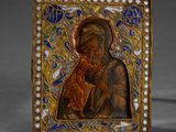 an ornately painted icon of the virgin mary and child