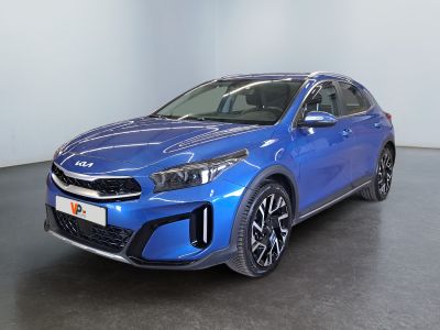 a blue car is parked in a room with a black floor