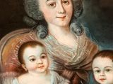 an old painting of a woman and two children sitting in a chair