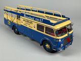 a blue and yellow fire truck with a ladder on it