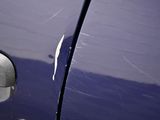 a close up of a car ' s door handle and door handle