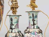 three vases are sitting next to each other on a table