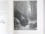 un livre ouvert sur lequel figure un dessin en noir et blanc représentant une scène de forêt