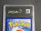 a close up of a pokemon card on a table