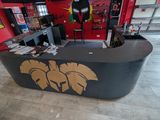 a black counter with a gold design in a red room
