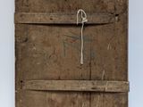 an old wooden box with a rope hanging from it ' s side