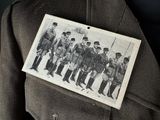an old photo of a group of men in uniform