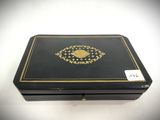an image of a black box with a gold eye on it