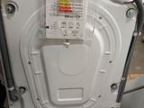 a white dishwasher that has a label on it