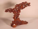 chinese carved wood table top with a bird on top of it