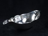 an image of a silver bowl with a tag on it