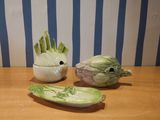 a small bowl and a small bowl of vegetables on a table