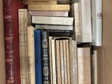 a box full of books that are sitting on the floor
