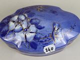 a blue box with flowers on it on a table