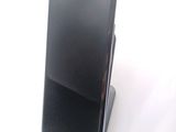 a cell phone that is sitting on top of a stand