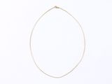 a necklace with a gold chain on a white background