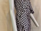 a mannequin wearing a black and white dress on a mannequin mannequin