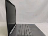 a laptop that is sitting on a white surface