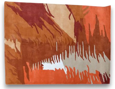 an orange, brown and white rug with a picture of a mountain