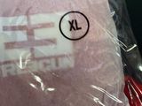 a pink blanket that has a sticker on it