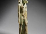 an egyptian statue of a man with a bird ' s head on his head