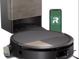 an image of a robotic vacuum cleaner with a phone connected to it
