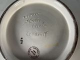 a close up of a white plate with writing on it