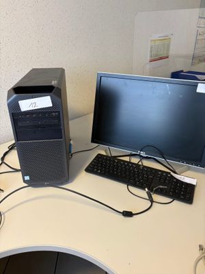 a desktop computer sitting on a desk with a keyboard and mouse