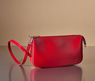 an image of a red purse on a table