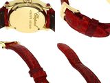 three different views of a wrist watch with a red strap
