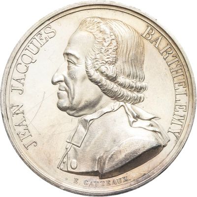 gros plan d'une pièce d'argent avec le portrait d'un homme
