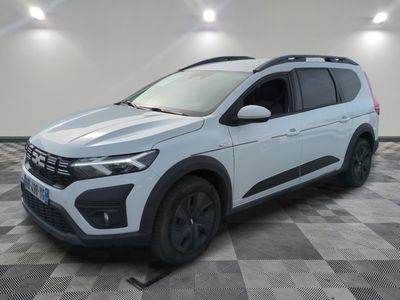 a white volkswagen suv parked on a checkered floor in a garage