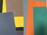 many different colors of paper on a table