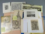 some of the drawings are on the table and some of them are in folders