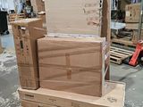 many boxes stacked on top of each other in a warehouse