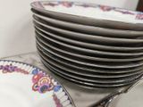 a lot of plates stacked on top of each other on a table