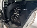 a white car with the door open and the seat up