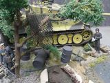 a model of a tank on display in a display case