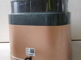 a brown and black blender sitting on a counter
