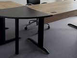an image of an office with a desk and chairs