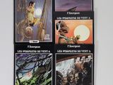 quatre livres posés sur une table avec un fond blanc et un fond blanc