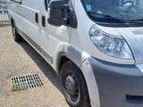 a white van that is parked on the side of the road