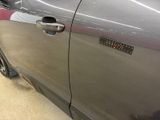 a close up of a car door with a sticker on it