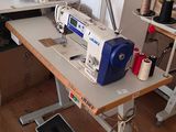 a sewing machine sitting on a table in a room